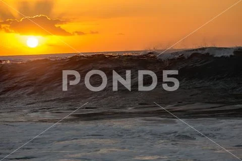 Sunset ocean wave rising Stock Photos