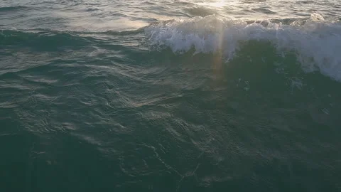 Sunset ocean wave surface, water ripples with golden sunlight reflection Stock Footage 257876799