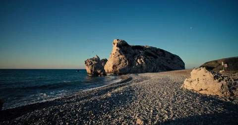 Sunset Ocean Waves Breaking on Rocky Shoreline - Serene Nature Background Stock Footage 275293277