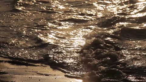 Sunset Ocean waves crashing onto the shore Stock Footage 78073136