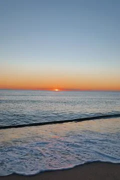 Sunset ocean waves Stock Photos