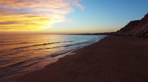 Sunset at oceanside cliffs beach aerial Portugal Algarve aerial view Stock Footage 58949843