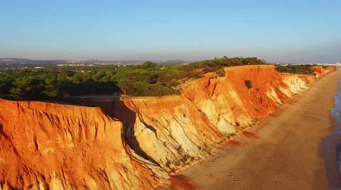 Sunset at oceanside cliffs beach aerial Portugal Algarve aerial view Stock Footage 58949860