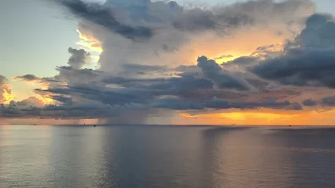 Sunset at offshore location with production platform and drilling rig Stock Footage 323886312