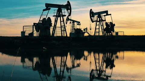 Sunset at the oil development site with a river nearby. Crude oil, gas Video stock 142429744