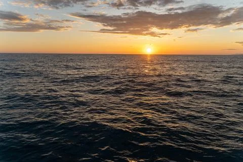 Sunset in the open sea Stock Photos
