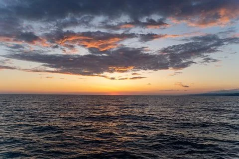 Sunset in the open sea Stock Photos