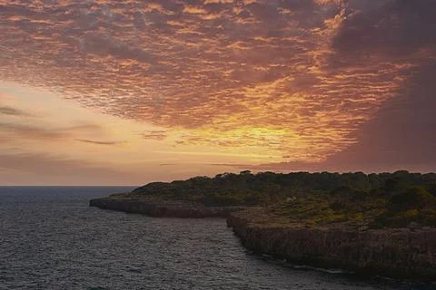 Sunset or sunrise on the coastline with cliffs Stock Photos