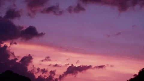 Sunset or sunrise with dark cloud on pastel purple blue n red pink sky Stock Footage 167930639