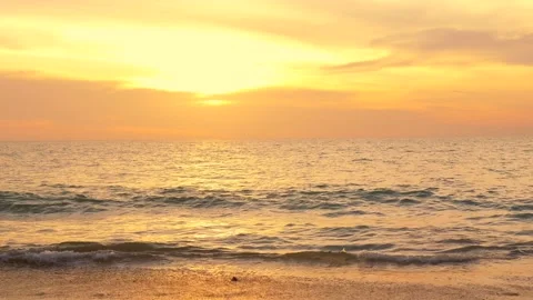 Sunset or sunrise landscape on sandy beach. Sunset over ocean waves on paradise Stock Footage 235565043