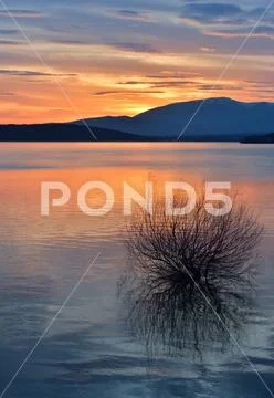 Sunset or sunrise landscape,beautiful nature.Sky,amazing colorful clouds.Lake. Stock Photos