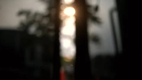 Sunset or sunrise when the sun is visible through the bedroom window Stock Footage 285582268