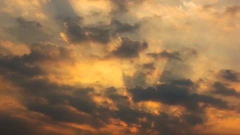Sunset orange beam sky background with white clouds cumulus floating soft f.. Stock Photos