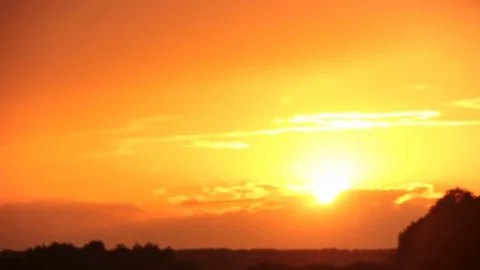 Sunset with orange colors over the field. Nice clouds in the end. Stock Footage 76264176