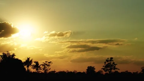 Sunset with orange sky and clouds in the evening landscape Time Lapse Stock Footage 328161326