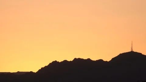Sunset orange sky, mountains siluhuate on desert 스톡 동영상 119320830
