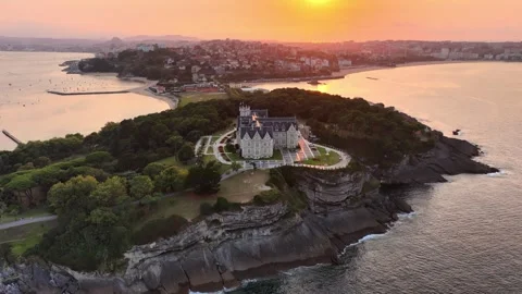 Sunset orbiting drone shot of Santander, famous city in Cantabria, northern Stock Footage 320303338