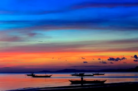 Sunset outriggers Stock Photos