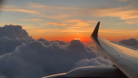Sunset outside aircraft window. Stockbeeldmateriaal 114134719