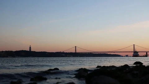 Sunset over 25 April bridge Lisbon Stock Footage 76235618
