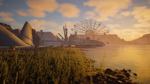 Sunset over abandoned structures and a Ferris wheel by the water. Stock Footage 318321826