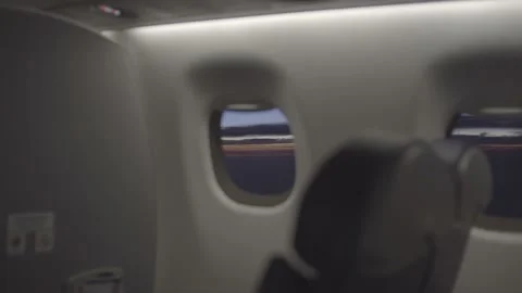 Sunset over airplane window 4K Stock Footage 157498181