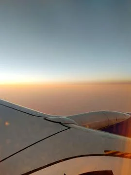 Sunset Over an Airplane Wing Stock Photos