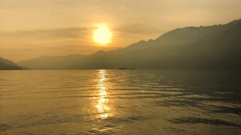 Sunset Over Alpine Lake with Mountain Stock Footage 111698027