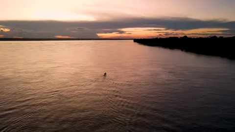Sunset over Amazon River with a boat Vídeo Stock 330925704