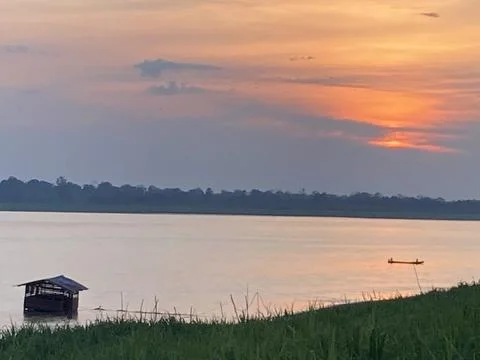 Sunset Over the Amazon Riverbank Stock Photos