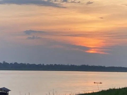 Sunset Over the Amazon Riverbank Stock Photos