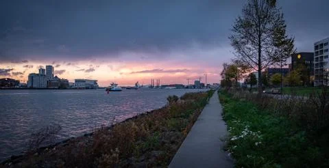 Sunset over amsterdam waterfront Stock Photos