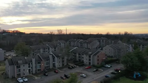 Sunset over Apartments drone Stock Footage 264008173