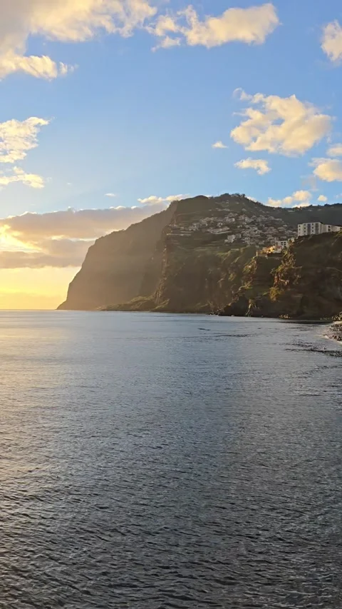 Sunset over the Atlantic Ocean from Câmara de Lobos, Madeira.  Video stock 310024721