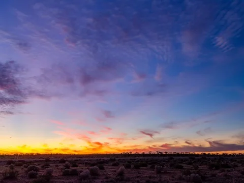 Sunset over the australian desert timelapse Stock Footage 70827292