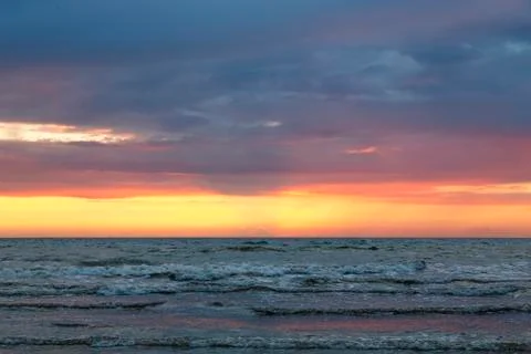 Sunset over the baltic sea with cloudscape Stock Photos