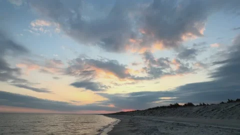 Sunset over the Baltic Sea at Graal-Mritz, Germany: a tranquil beach scene. Stock Footage 311466637