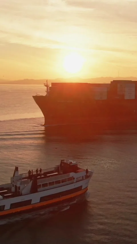 Sunset over the bay with a ferry and container ship. , Oakland, USA Stock Footage 317599359
