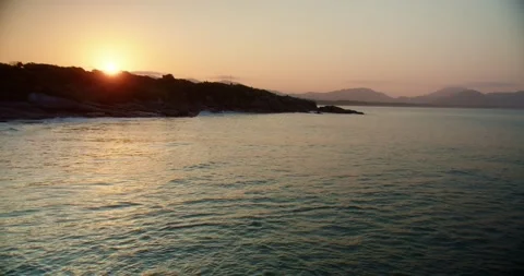 Sunset Over the Bay With Mountains in Background Stockbeeldmateriaal 247462013