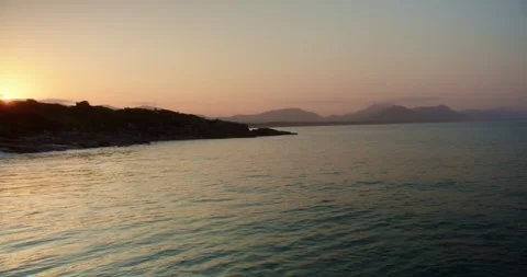 Sunset Over the Bay With Mountains in Background Stock Footage 247462260
