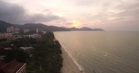 Sunset Over The Beach At Batu Ferringhi, Penang, Malaysia, Ascending Drone Stock Footage 79428058