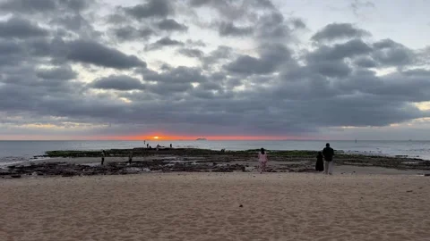 Sunset Over Beach with Dramatic Cloudy Sky Video stock 330270193
