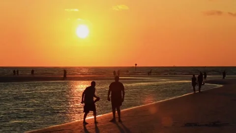 A sunset over a beach Stock Footage 155588836