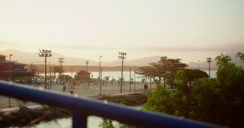 Sunset Over the Beach With Mountains in the Background Stock Footage 247460849