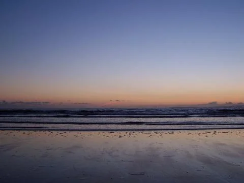 Sunset over the beach Stock Photos