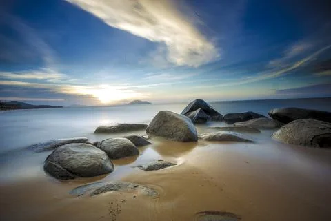 Sunset over the beach Stock Photos