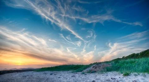 Sunset over beach Stock Photos