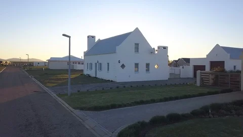 Sunset Over beautiful home Stock Footage 104081641