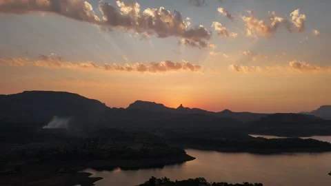 Sunset over Bhandardara lake and Sahyadri mountains India aerial 스톡 동영상 341127963