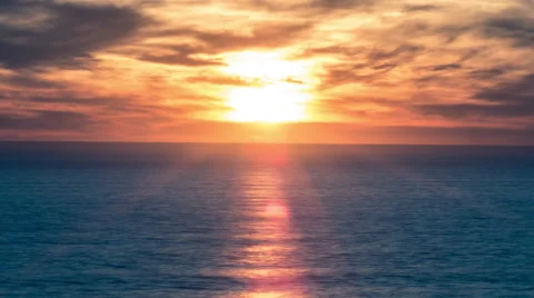 Sunset over Blue Ocean - Timelapse Sun Setting Orange Sky 4K Time-Lapse Water Stock Footage 45894784